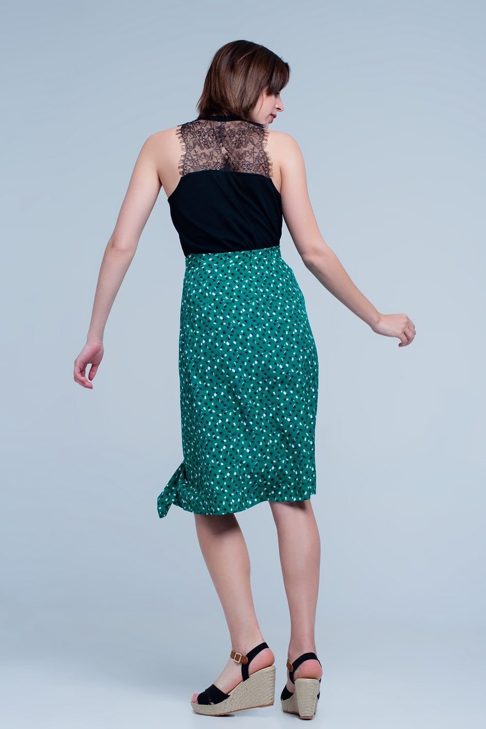 Jupe vert mi-longue avec volants et motif à pois