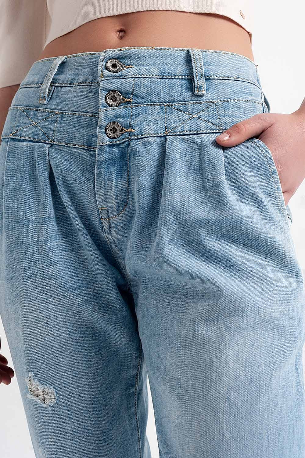 Jean à entrejambe bas en bleu délavé clair vintage avec déchirures