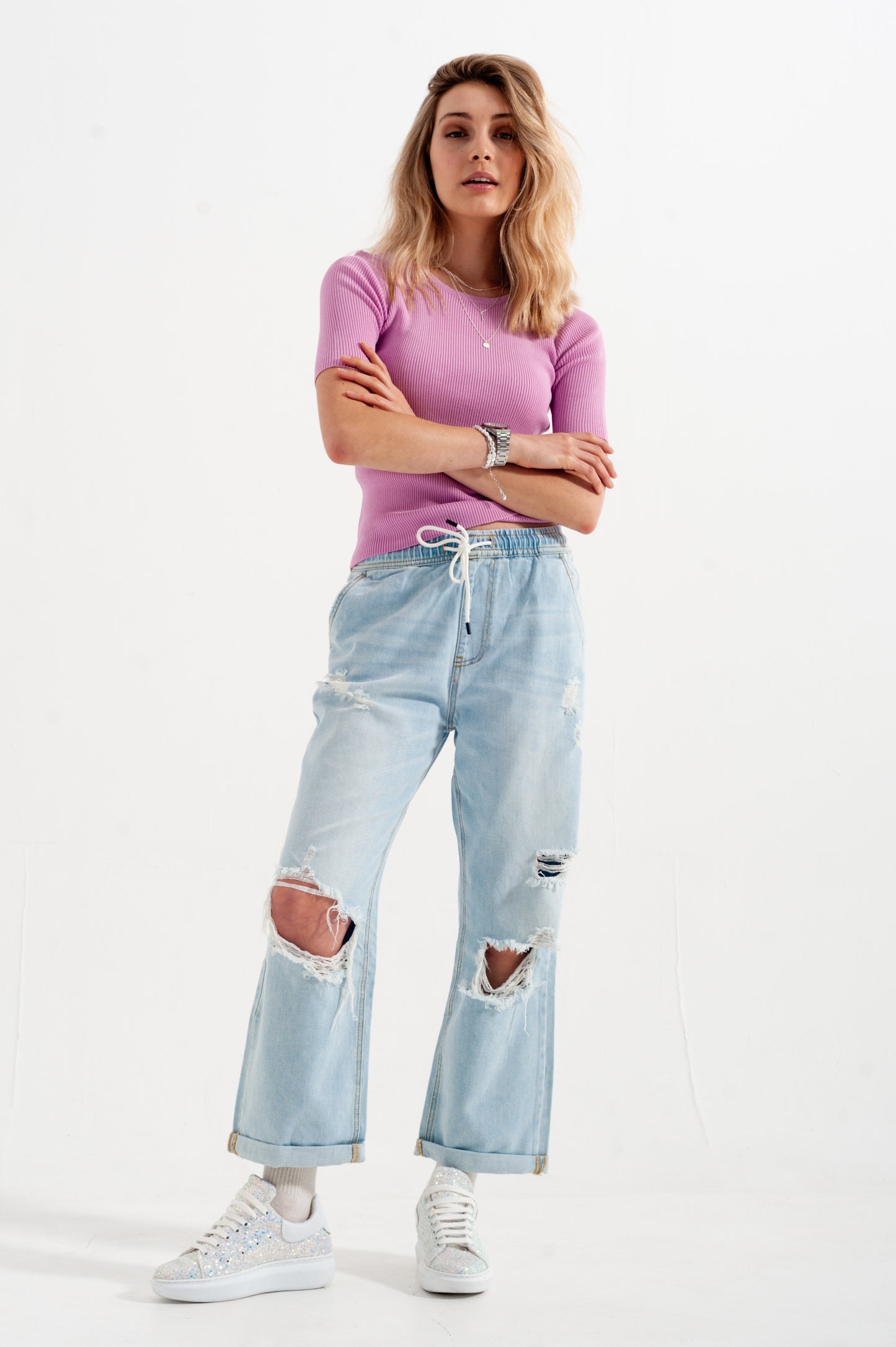 Pull rose en maille avec liens à nouer au dos