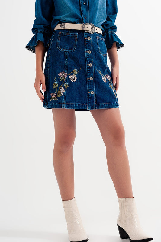 Jupe en denim avec des fleurs brodées et boutons
