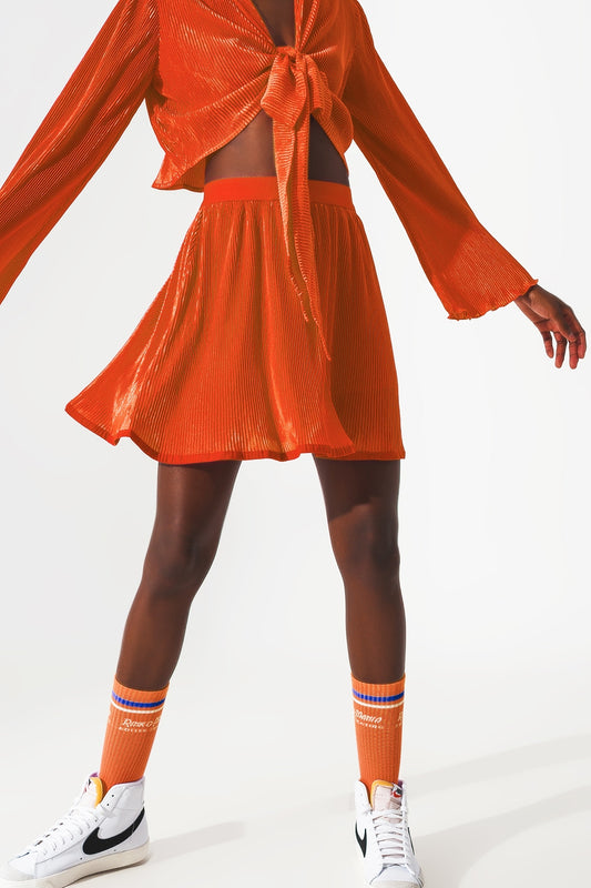 Jupe courte plissée en orange