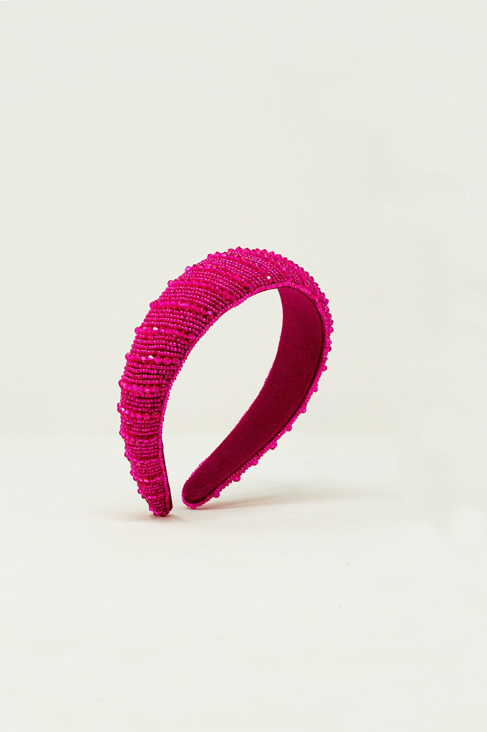Serre tête à perles en fuchsia