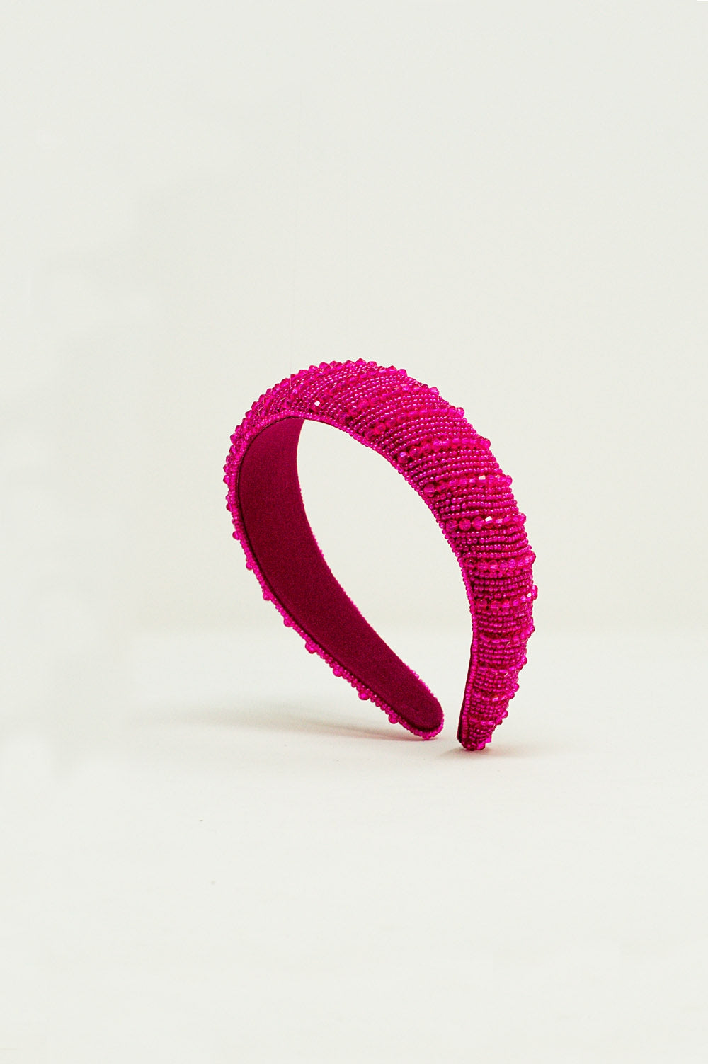 Serre tête à perles en fuchsia