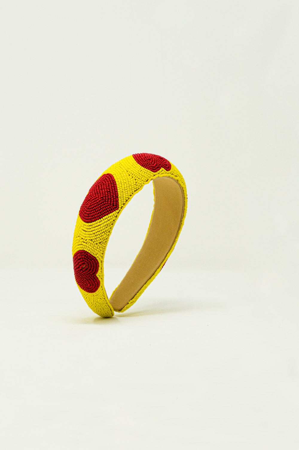 Serre tête à perles avec détails de cœur en jaune