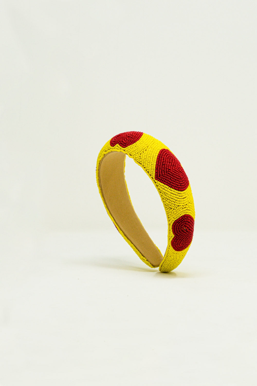 Serre tête à perles avec détails de cœur en jaune
