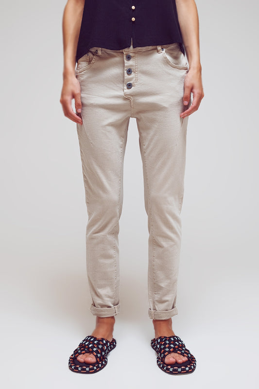 Jean skinny avec boutons apparents en beige