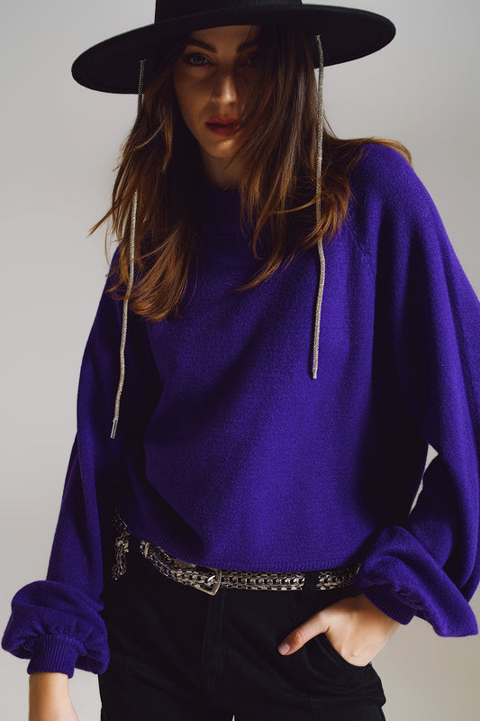pull violet décontracté avec des manches bouffantes.