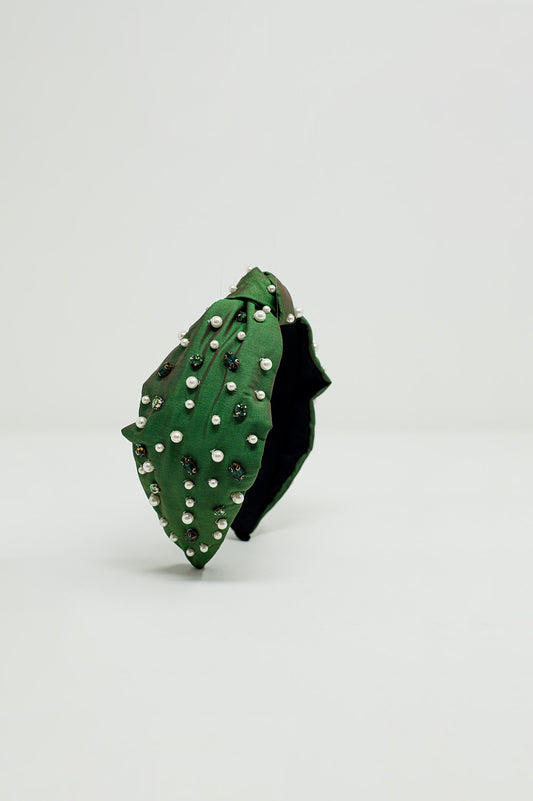 Bandeau orné de bijoux blancs et verts avec un nœud au milieu