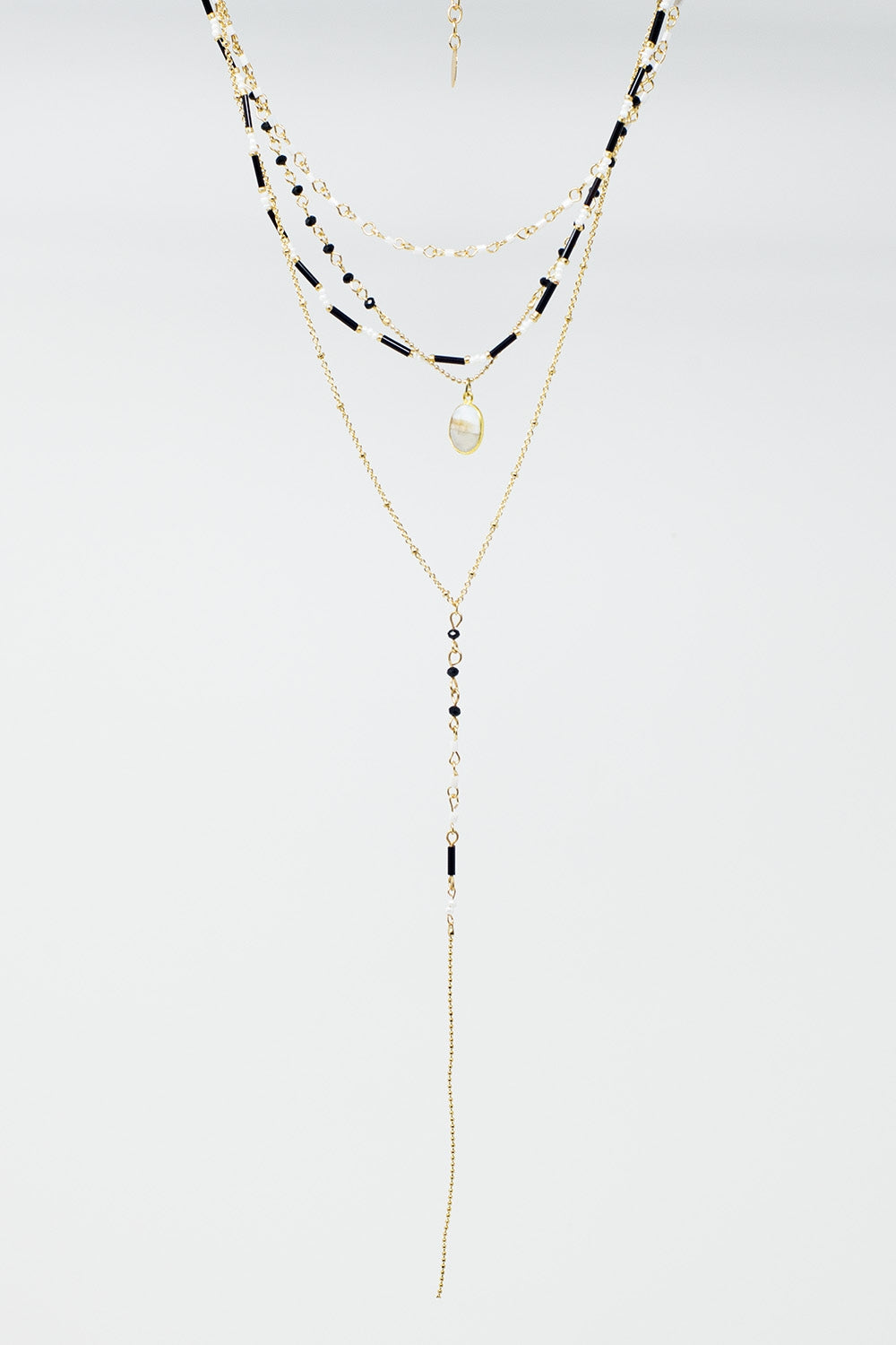 Collier 4 en 1 en or avec perles noires et blanches