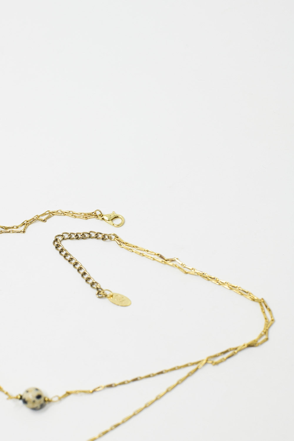 Collier 2 en 1 avec pierres marbrées noires et blanches
