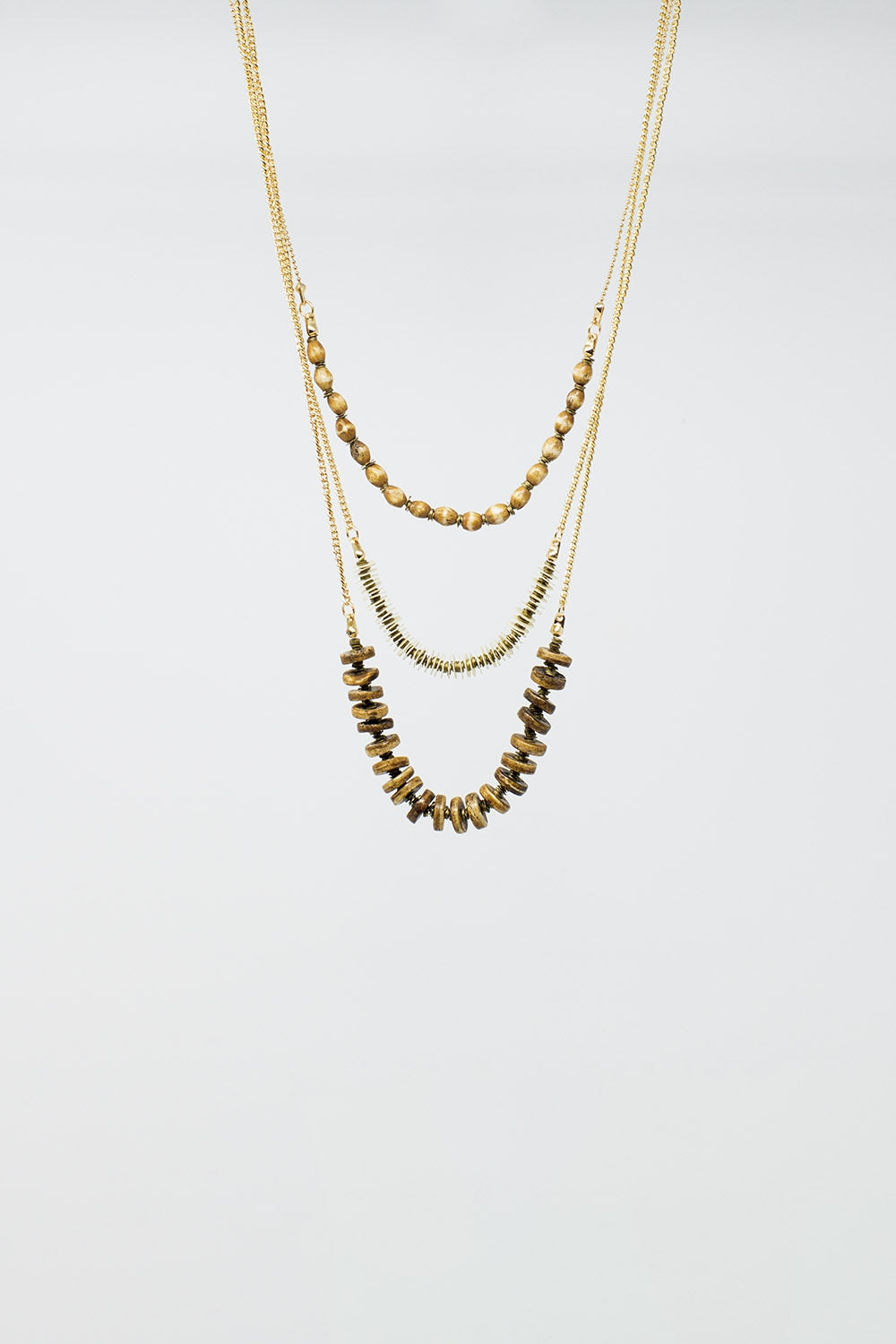 Collier 3 en 1 avec des perles dorées de différentes formes et tailles