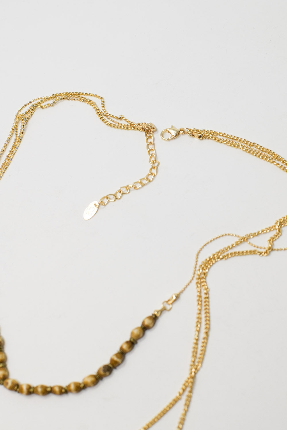 Collier 3 en 1 avec des perles dorées de différentes formes et tailles