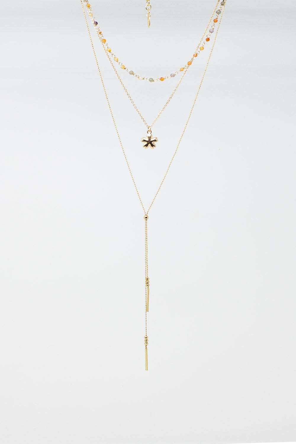 Collier 3 en 1 avec breloque étoile et perles multicolores.