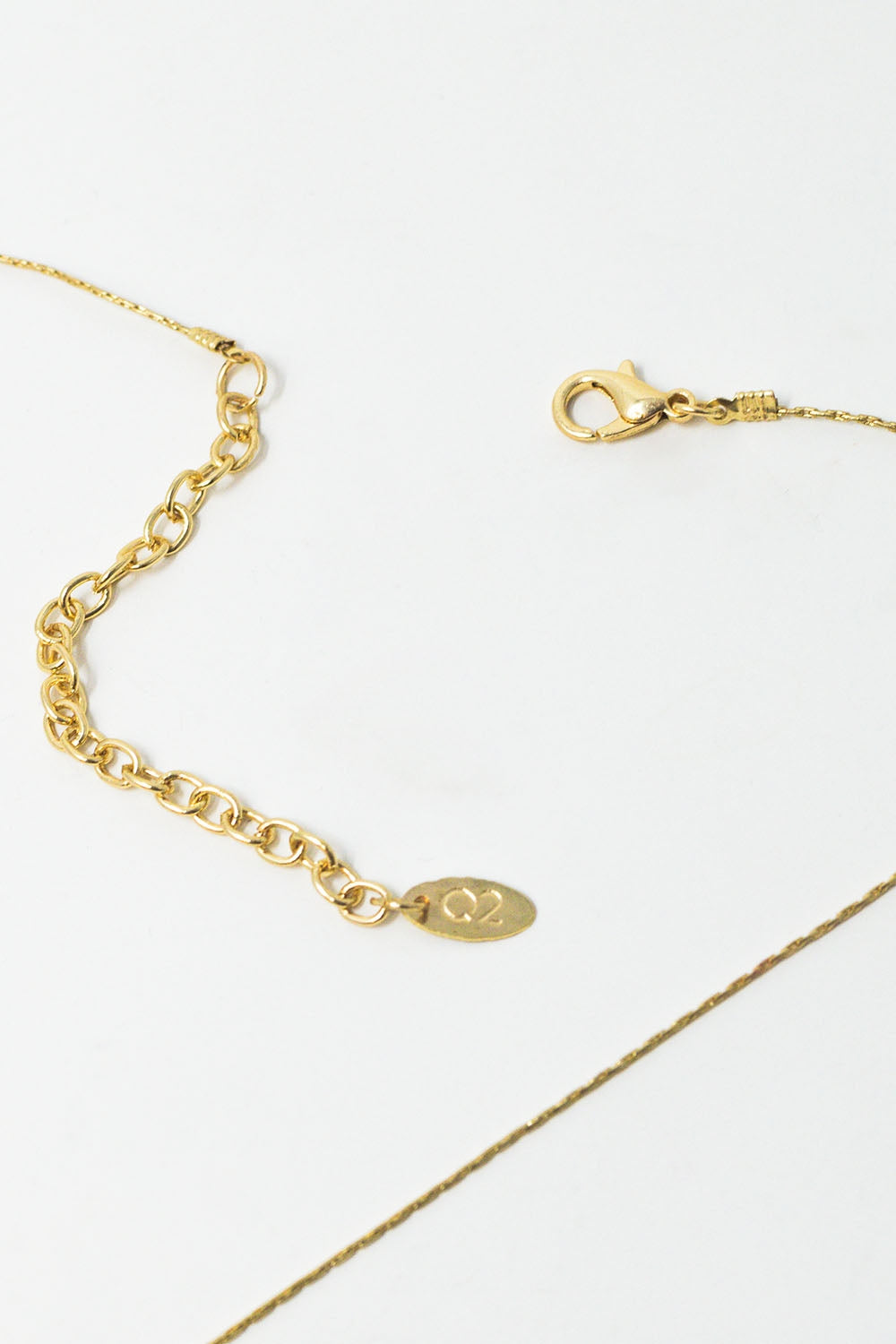 Long collier en or avec des perles en or et un long pompon en or
