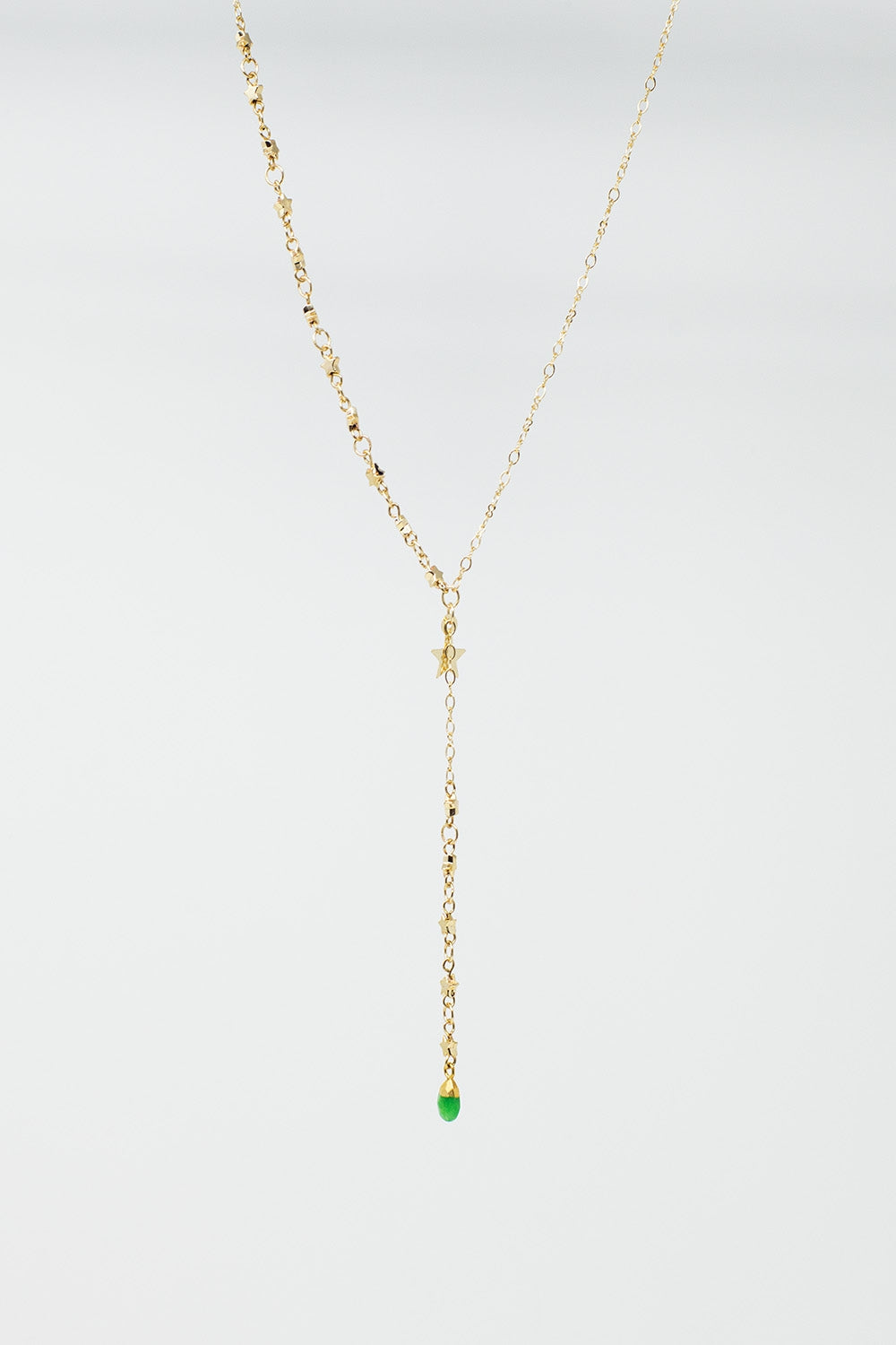Collier en or avec breloque étoile et perle verte