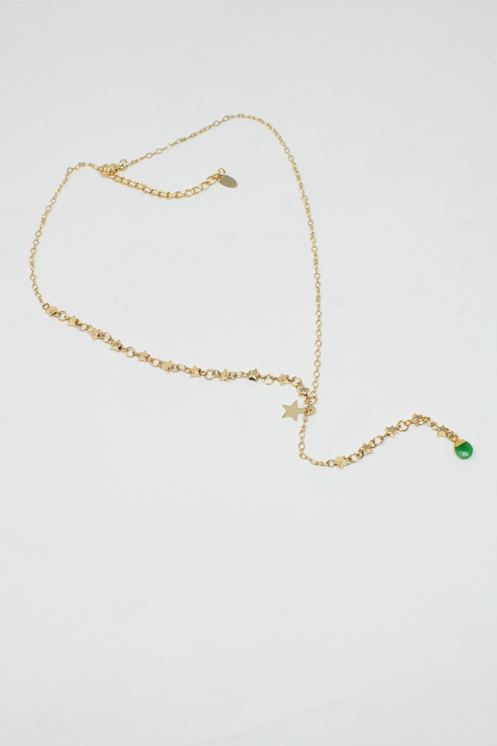 Collier en or avec breloque étoile et perle verte