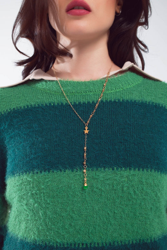Collier en or avec breloque étoile et perle verte