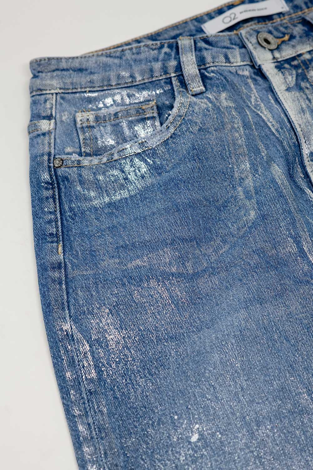 Jean bleu skinny avec finition métallique en délavage léger
