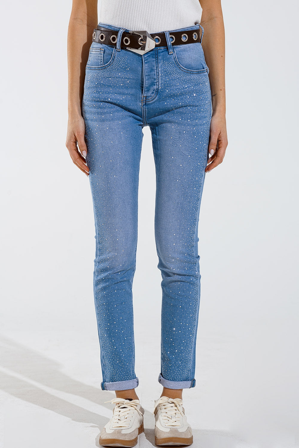 Jean skinny bleu délavé avec strass sur le devant