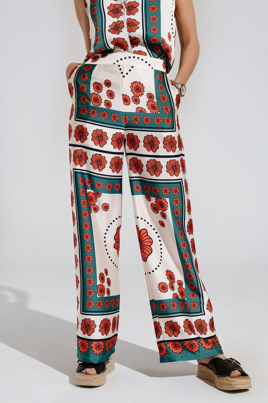 Pantalon évasé crème à motifs floraux