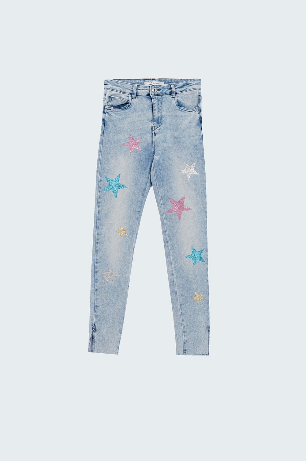 Jean skinny délavé avec étoiles sur les jambes