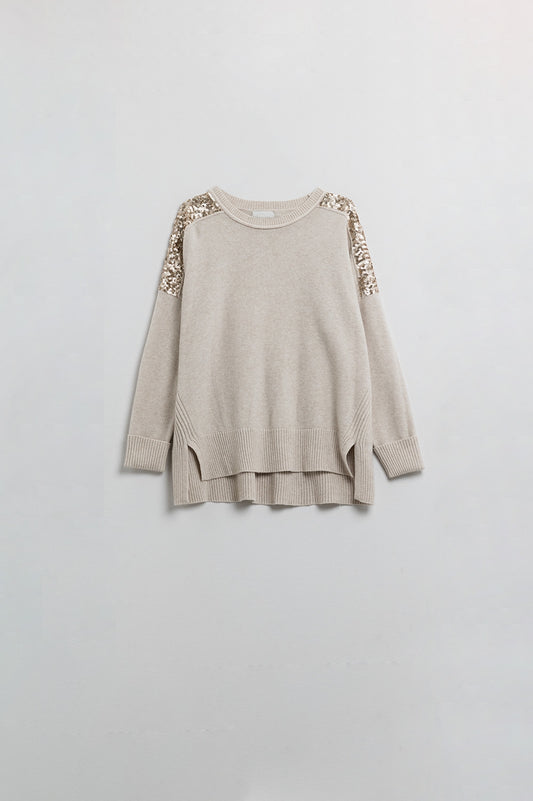 Pull beige à manches longues avec paillettes sur les épaules