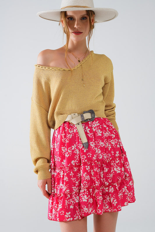 Pull léger à large col en V avec détails tressés en or