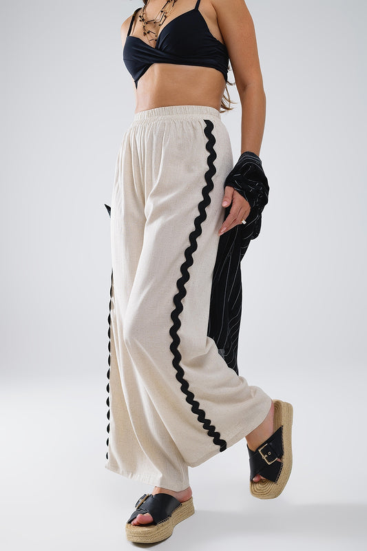 Pantalon en lin à bordures festonnées contrastées beige