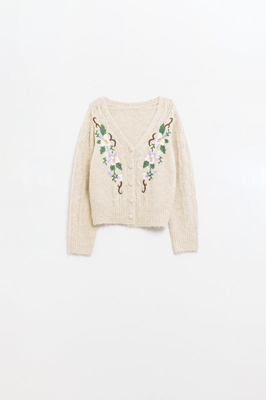 Cardigan beige en maille torsadée avec fleurs brodées