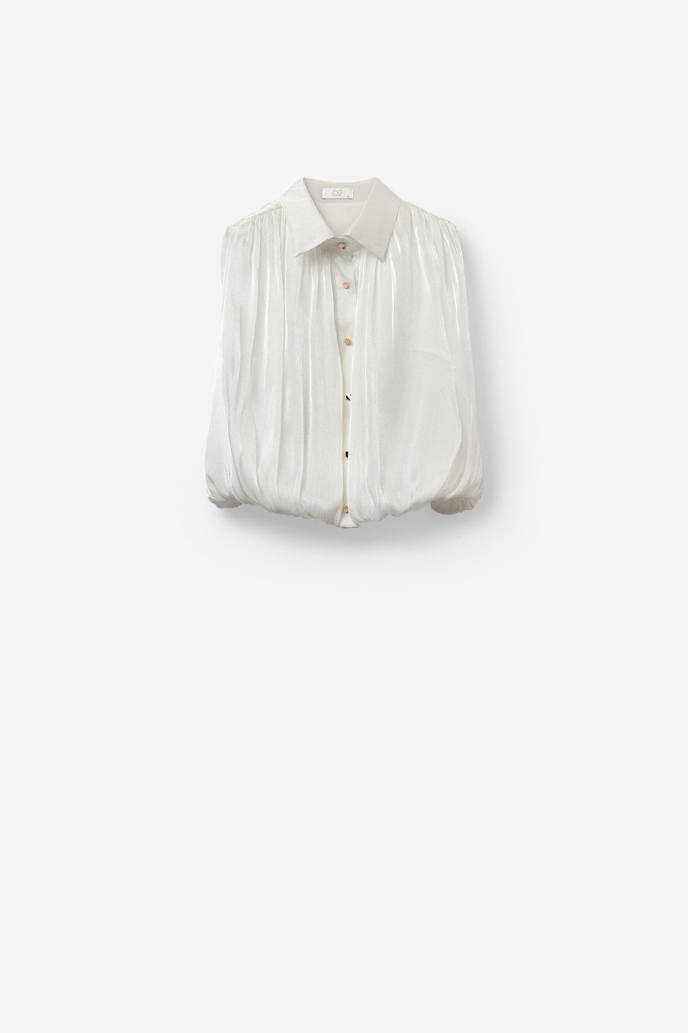 Blouse blanche sans manches à ourlet froncé avec boutons dorés
