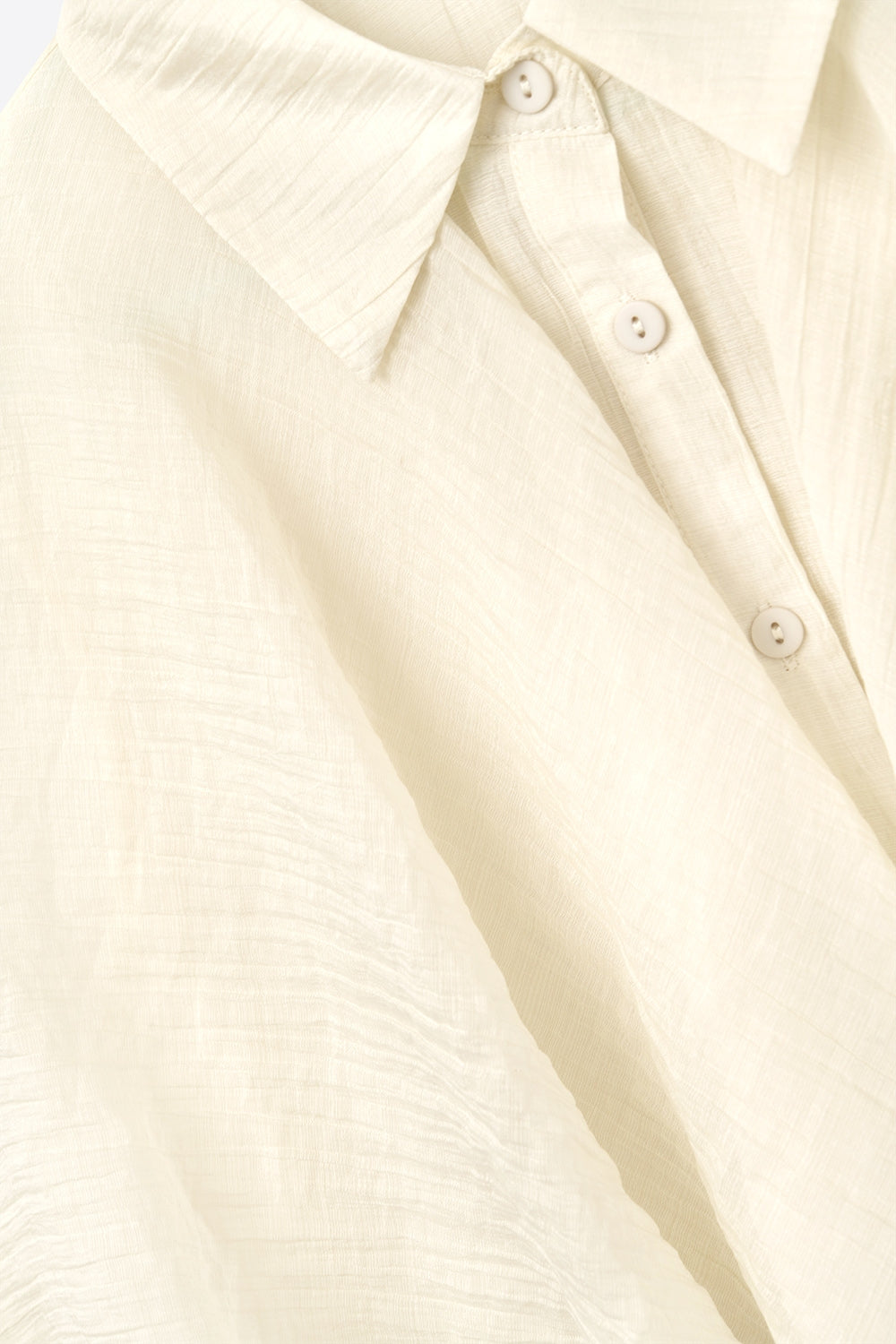 Blouse en mousseline de soie texturée beige à manches tombantes