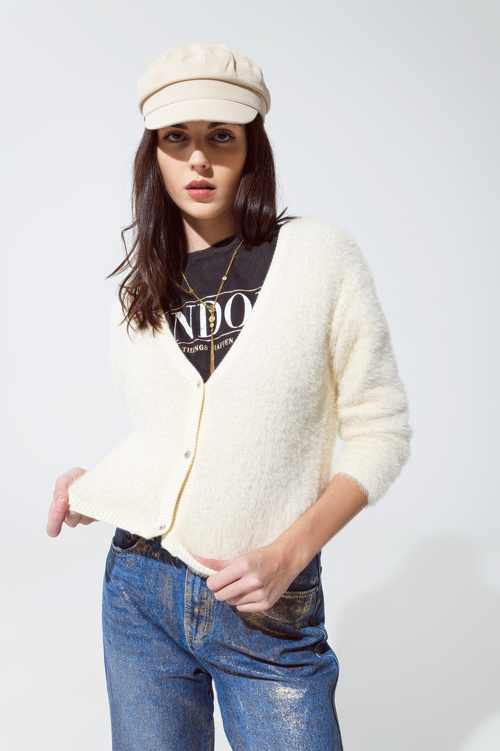 Cardigan creme en peluche et bas argentés