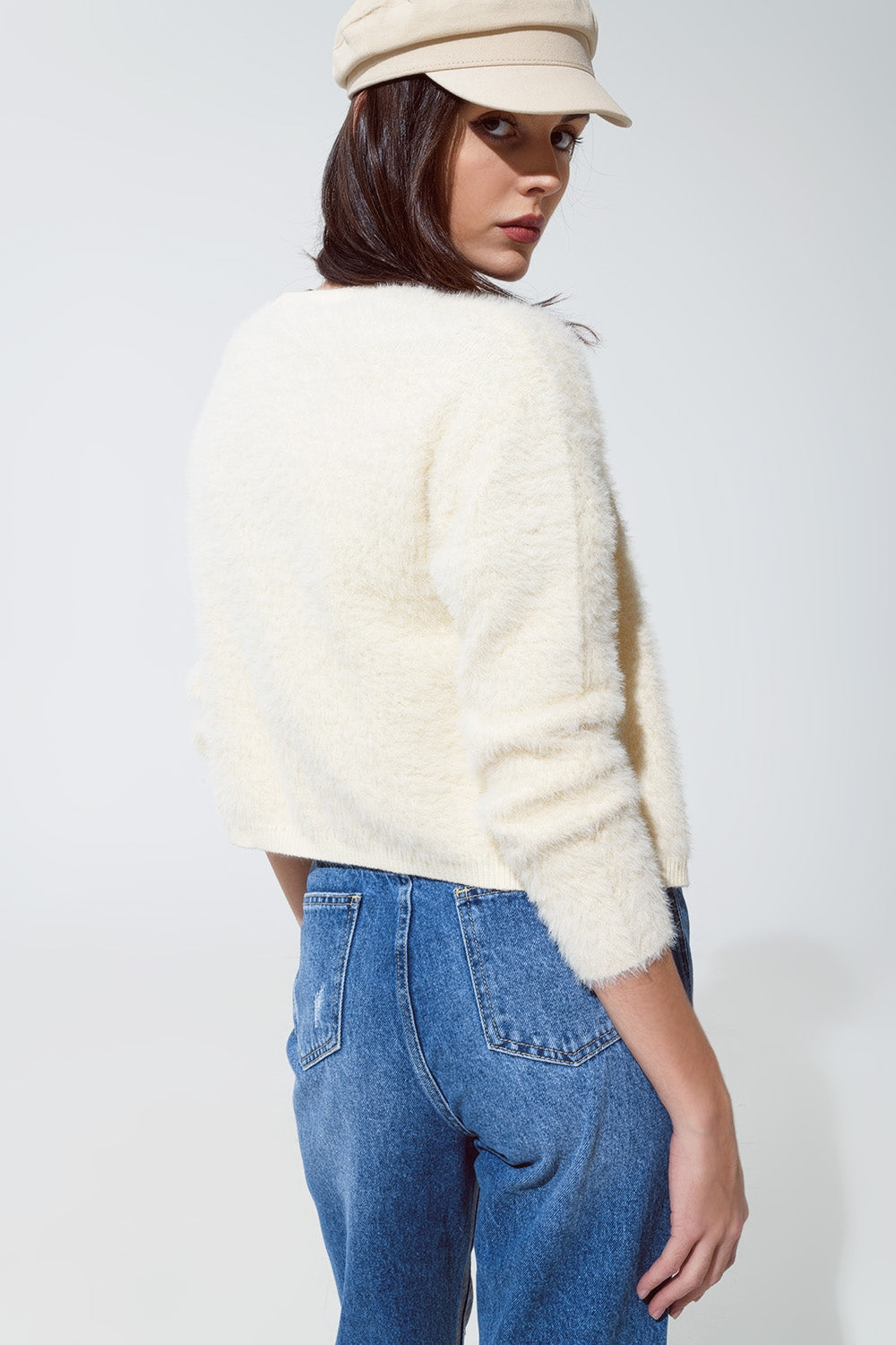 Cardigan creme en peluche et bas argentés