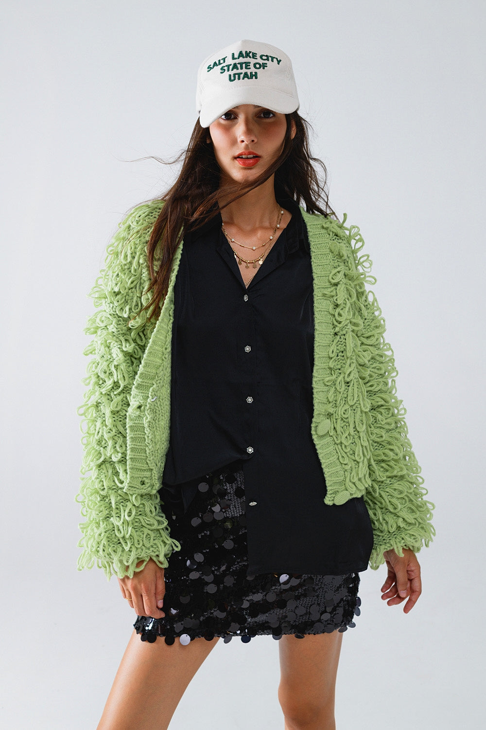 Cardigan épais texturé en vert avec longue frange