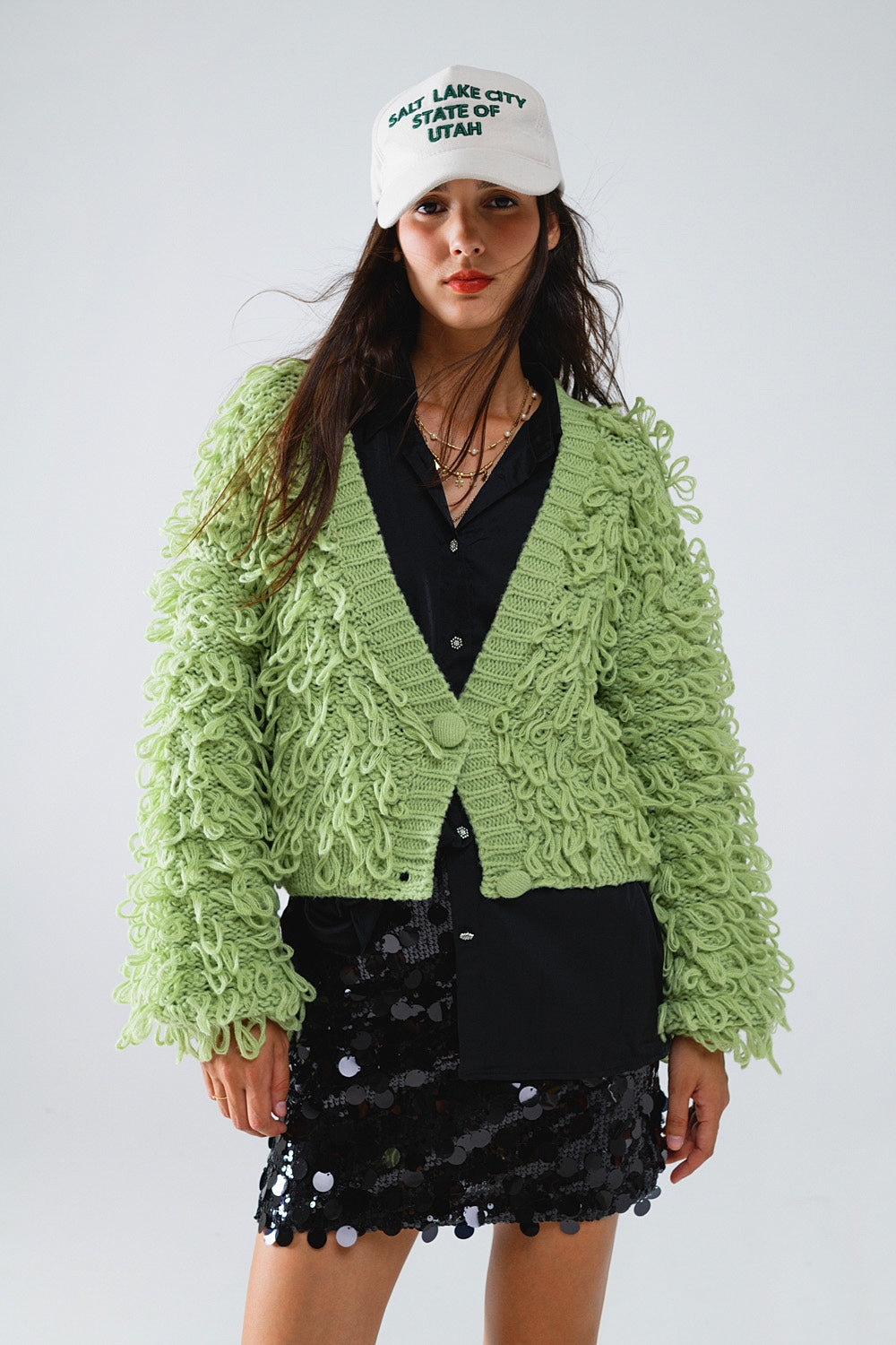 Cardigan épais texturé en vert avec longue frange