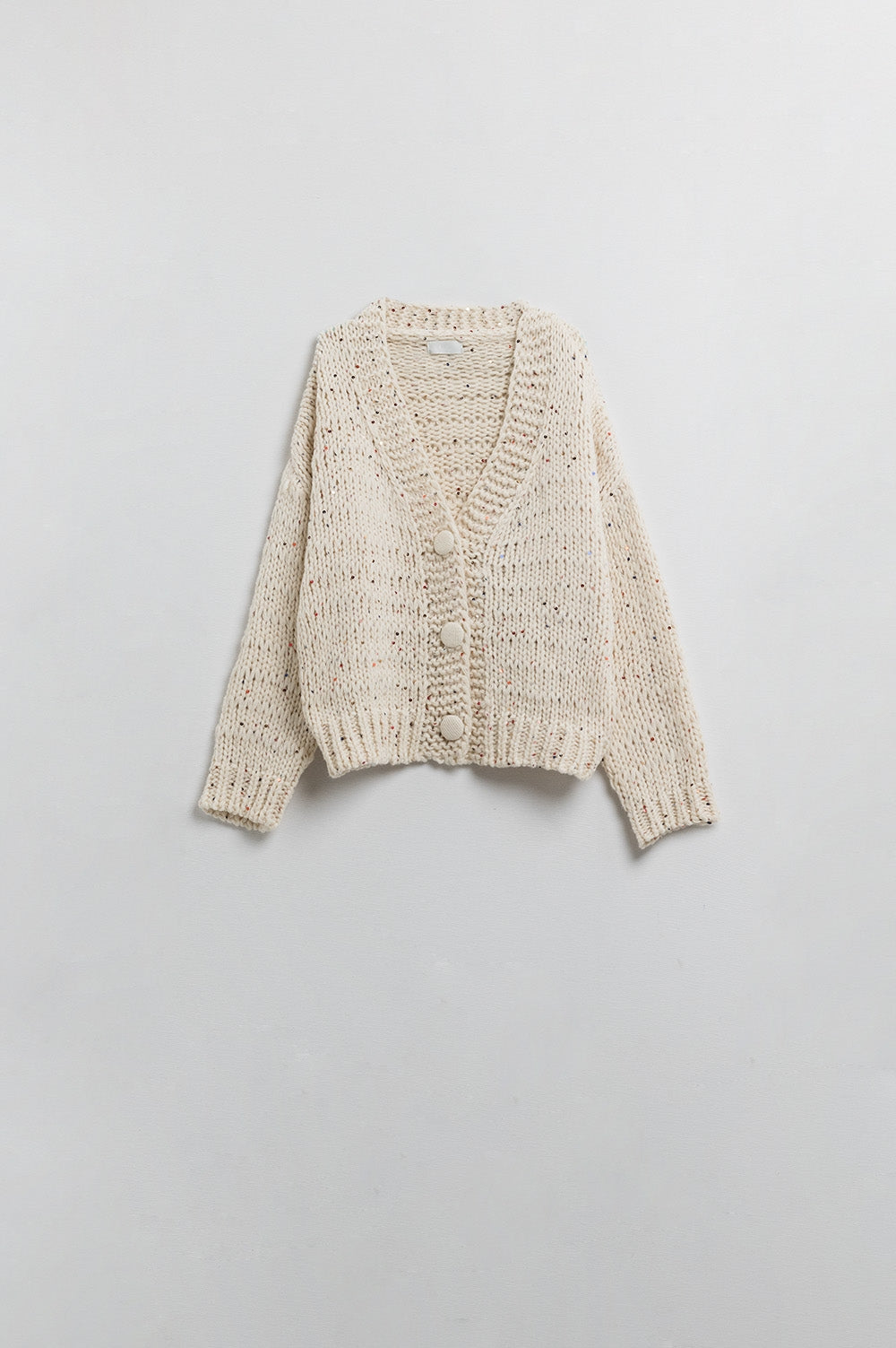 Cardigan oversize en maille épaisse de couleur crème avec détails en paillettes