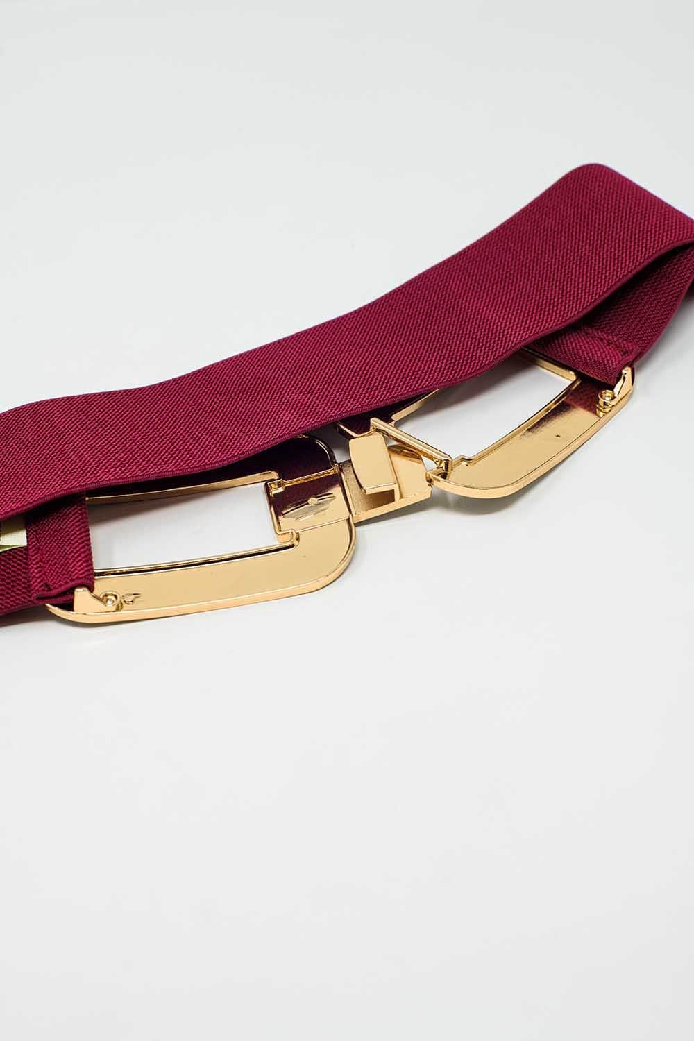 Ceinture élastique rouge avec double boucle ovale avec incrustations de strass