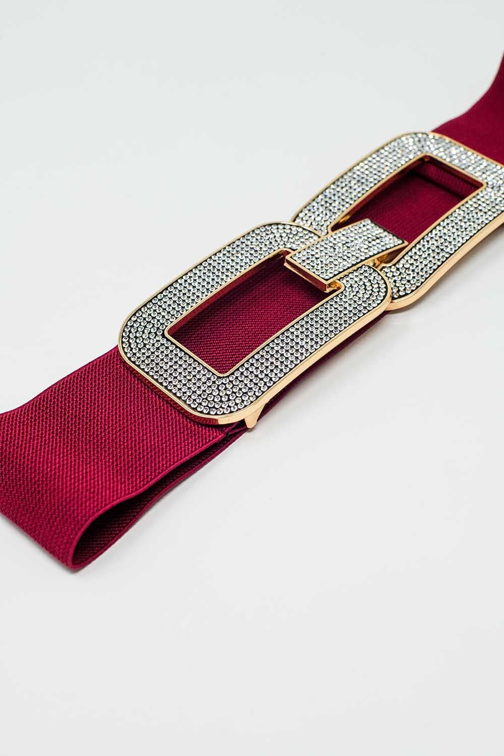 Ceinture élastique rouge avec double boucle ovale avec incrustations de strass