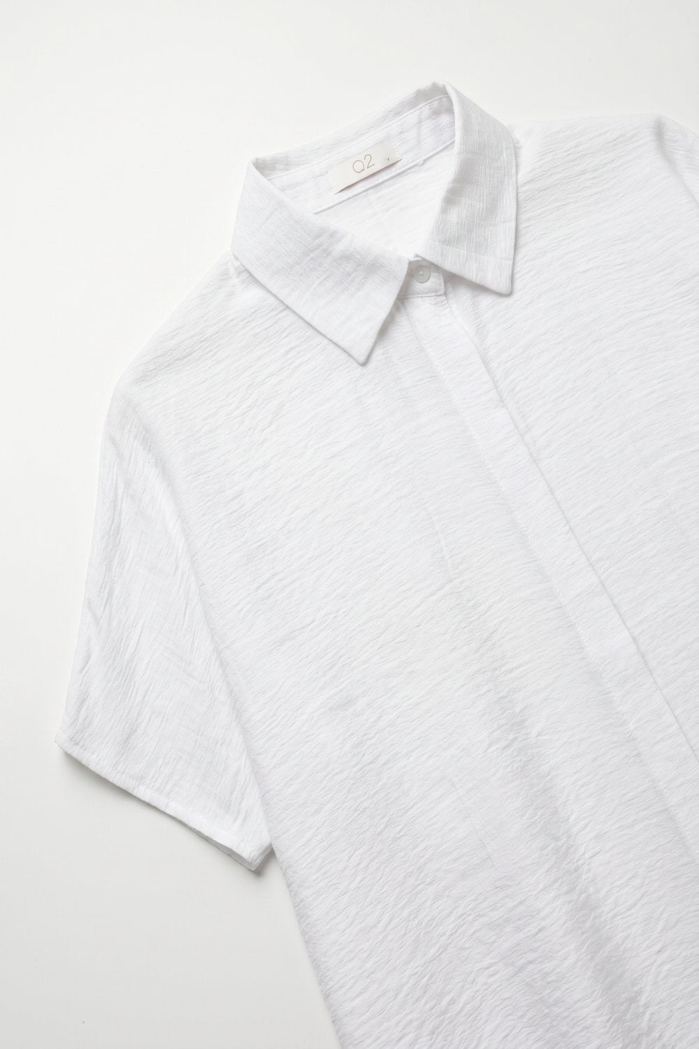 Chemise collet à coupe décontractée en coton texturé blanc à manches courtes