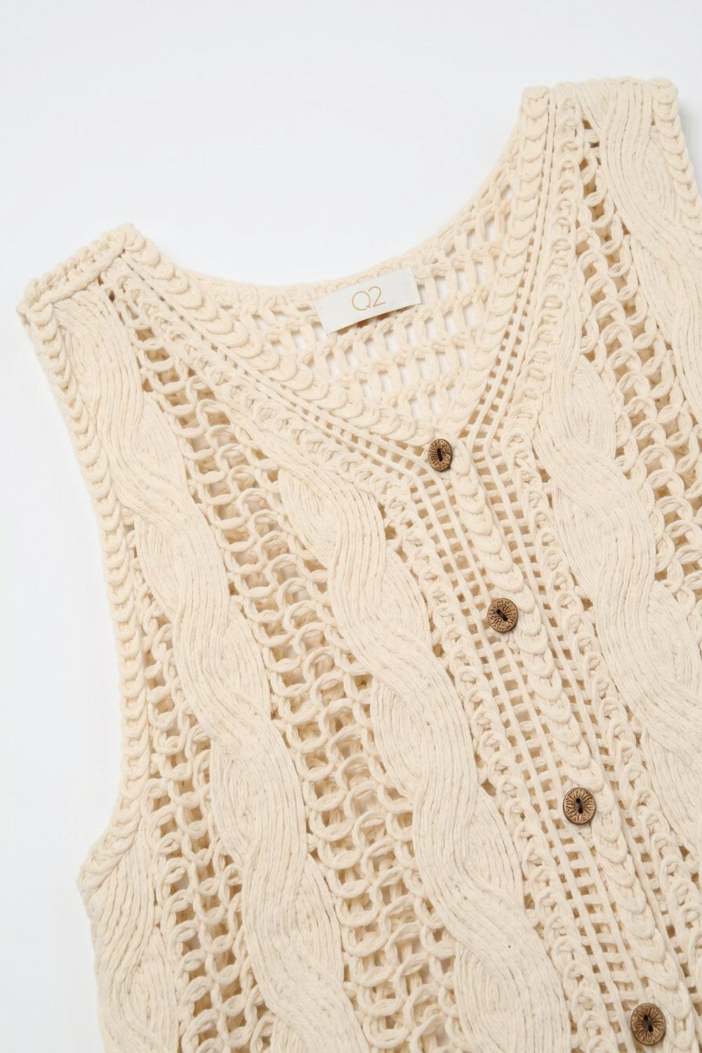 Débardeur court beige en maille torsadée avec boutons sur le devant