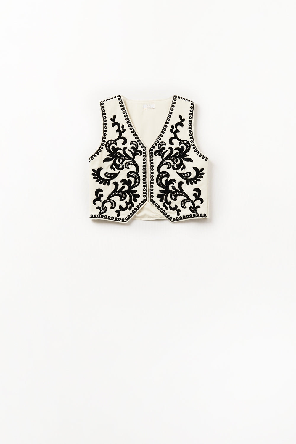 Gilet blanc avec broderie baroque noire