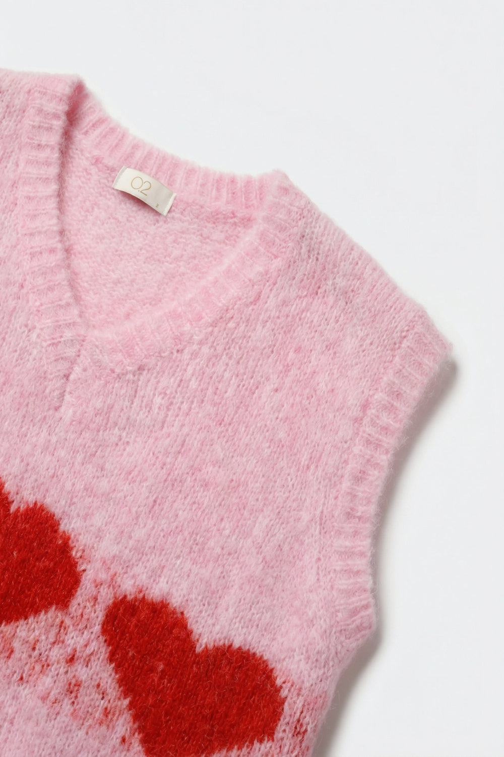 Gilet décontracté en tricot rose duveteux avec motif en forme de cœur