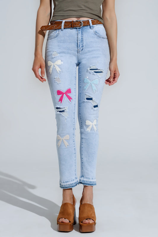 Q2 Jean super skinny bleu clair avec nœud papillon et trous déchirés