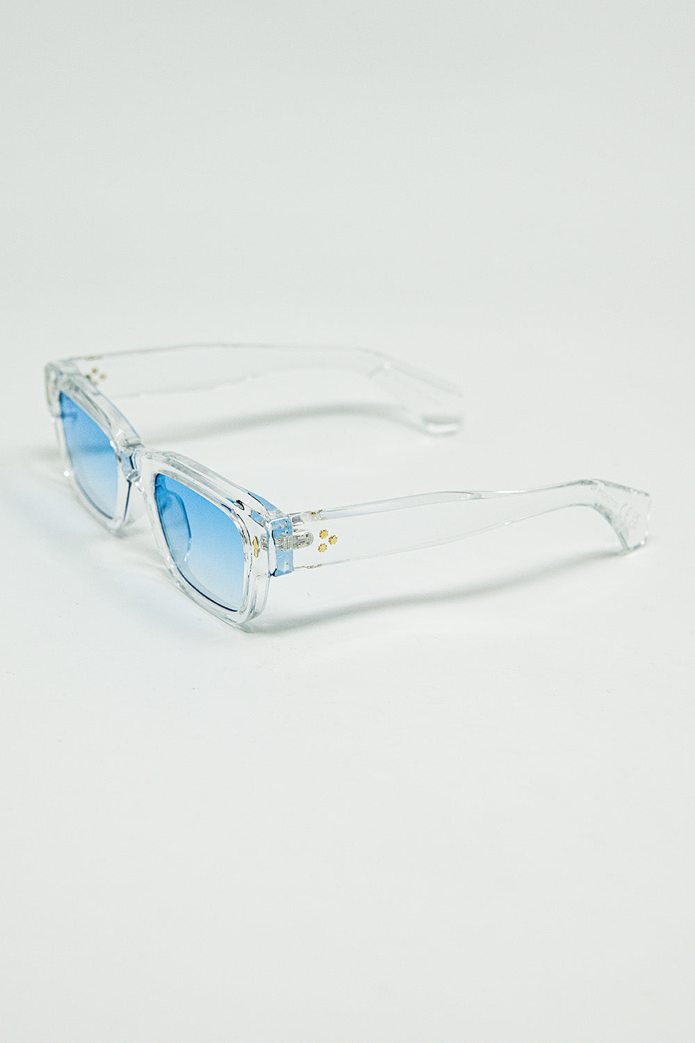 Lunettes de soleil blanches translucides avec verres ovales bleu clair