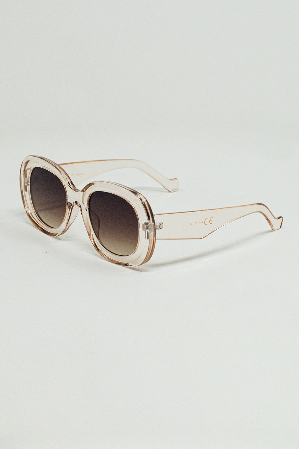 Lunettes de soleil circulaires surdimensionnées en blanc translucide