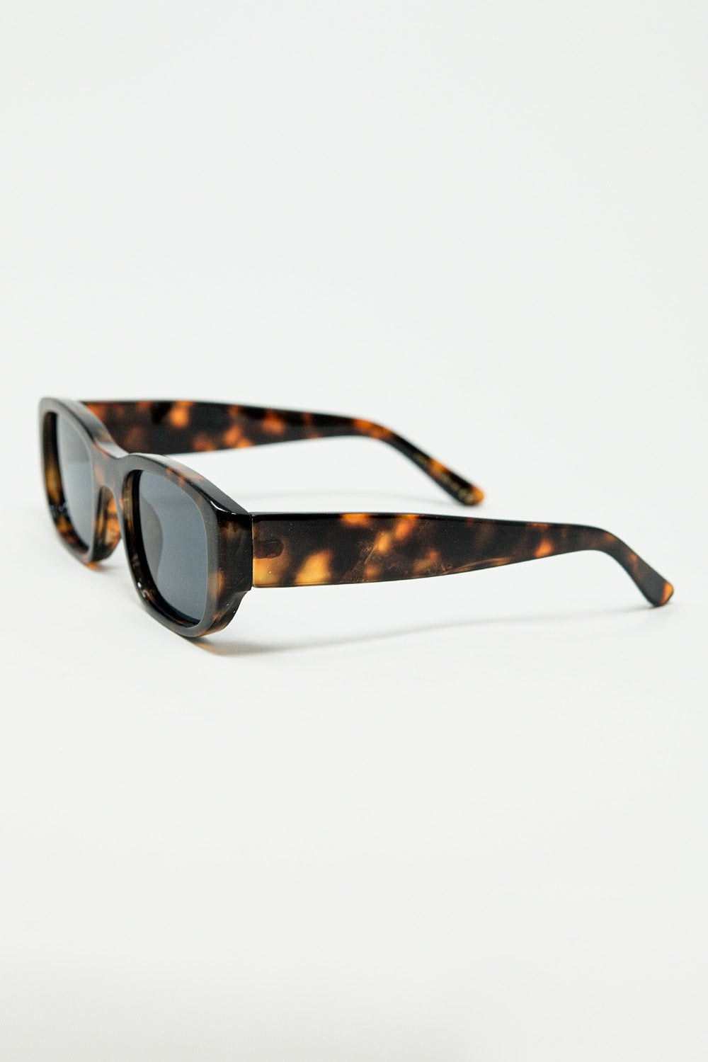 Lunettes de soleil ovales avec monture transparente haute brillance en marron