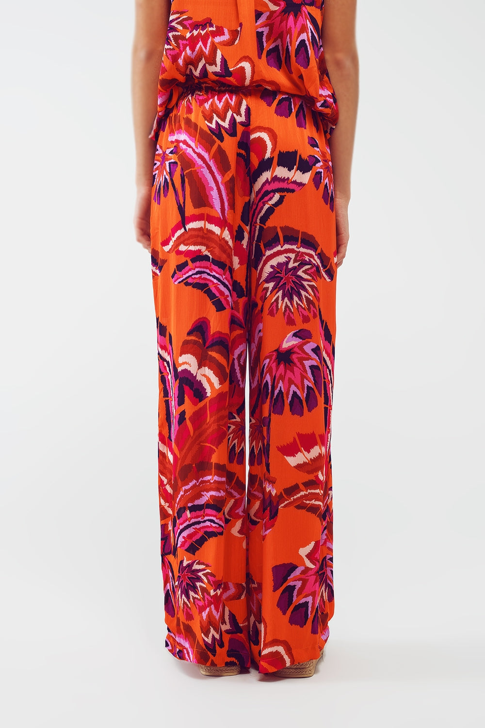 Pantalon de style palazzo à imprimé floral abstrait en orange