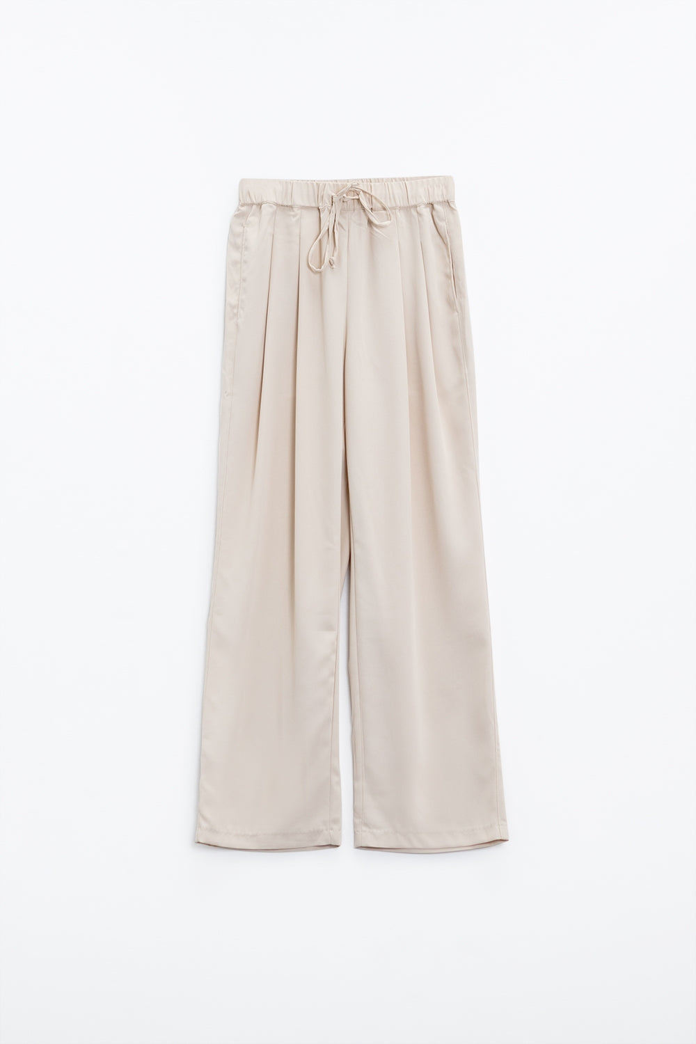 Pantalon en beige avec poches avant et fermeture par cordon de serrage