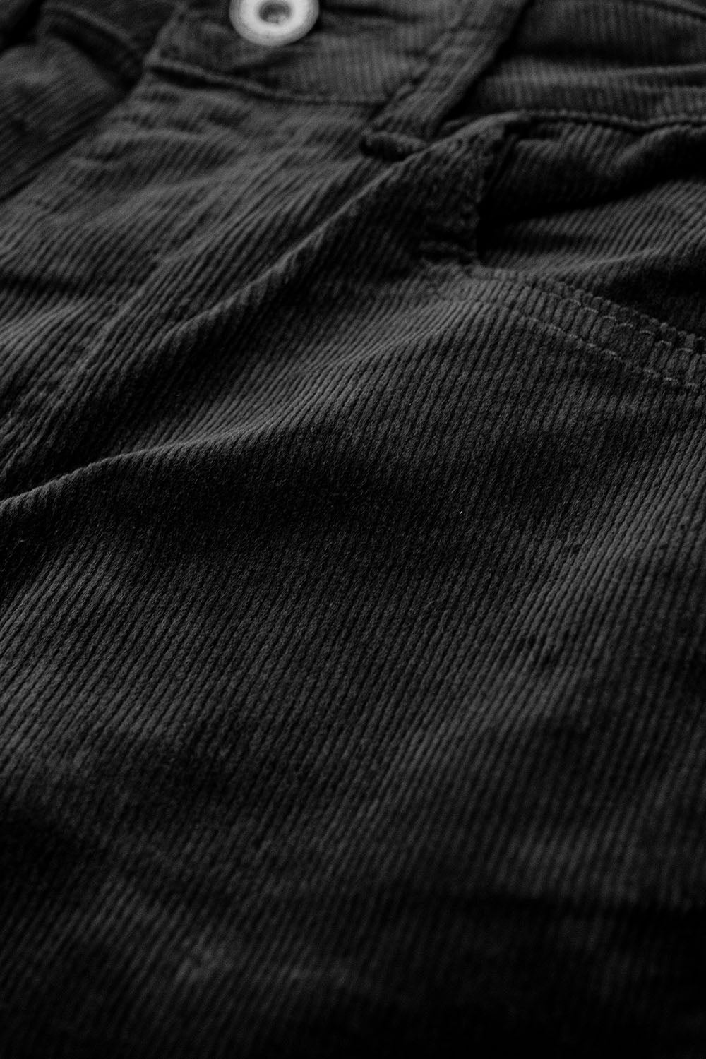 Pantalon évasé en velours côtelé noir avec imprimé léopard sur le bas