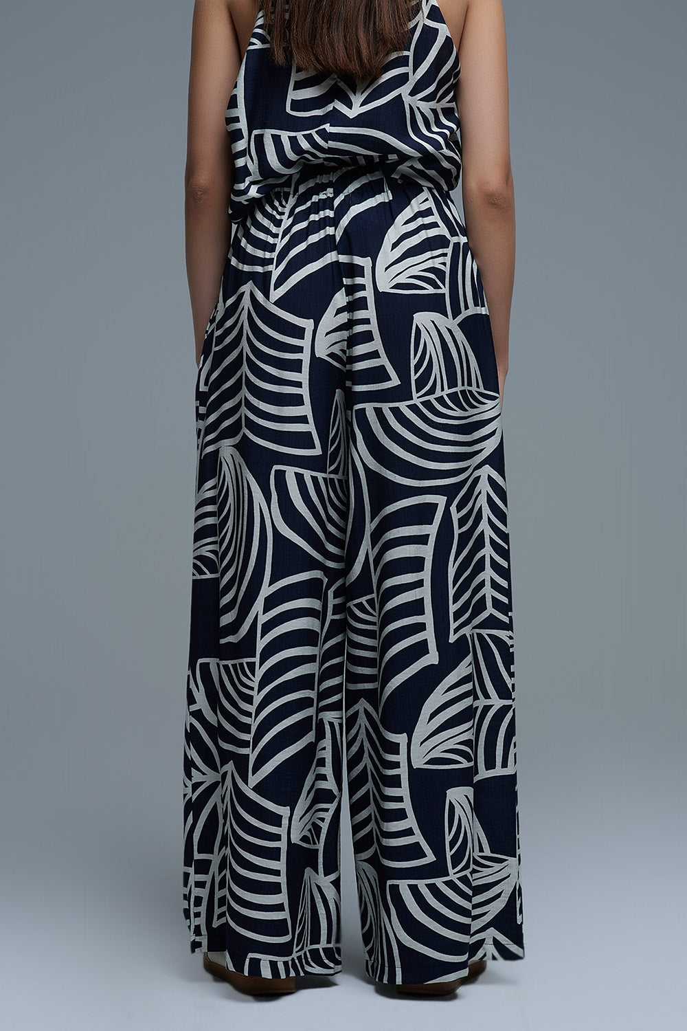 Pantalon large marine et blanc avec imprimé feuilles blanches